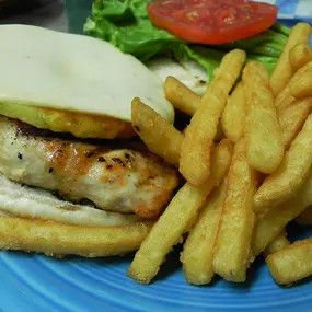 Big Kahuna Chicken Sandwich - Marinated chicken breast with a fresh grilled pineapple slice. Topped with pepper jack cheese and drizzled with honey jerk sauce.