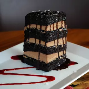 Seven Layer Chocolate Cake with hot fudge, Maldon sea salt, and raspberry coulis.