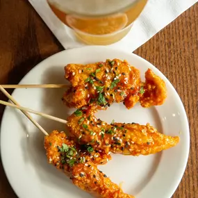 General Tso Chicken Skewers from Burtons Grill's Happy Hour Menu (available weekdays only, price and offering subject to change).