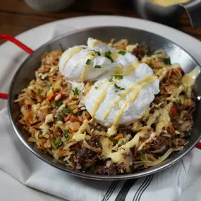 Short Rib Hash with braised short ribs, crispy potatoes, red & yellow peppers, poached eggs, and hollandaise (Weekend Brunch Menu).