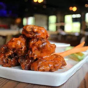 Marinated bone-in mesquite wings served with carrots and celery.