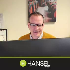 Director of Equipment Leasing & Financing: Eric Johnson working on his Hansel Leasing Computer.