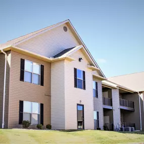 Exterior view of Sugar Creek Apartments' two-story buildings.