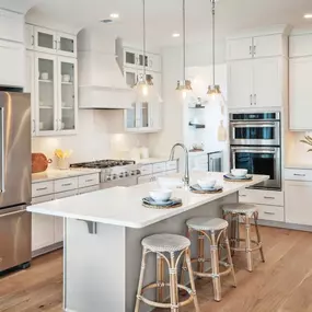 Stunning kitchens with large center islands and ample cabinet and counter space