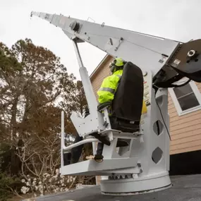 Licensed operator managing a crane lift on-site.