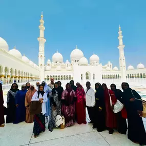 Our group outside of Sheikh Zayed Grand Mosque in Abu Dhabi,  the breathtaking third-largest mosque in the world with 82 golden-coated domes and white marble construction.