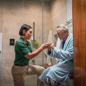 Home Instead Care Giver and their client getting ready for the day