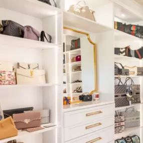 White and gold set this closet off. By accenting with the LED lighting this closet is a show piece!