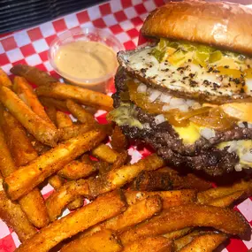 Double Wagyu Smashburger with a fried egg, cajun-seasoned tallow fries, and sloppy sauce
