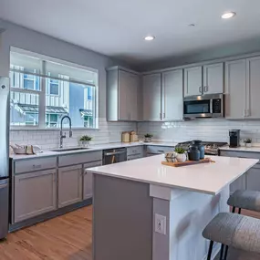 Modern Kitchen With Stainless Steel Appliances And Double Door Refrigerators