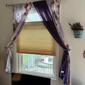 Lightly-colored top-down bottom-up cellular shades make a great match to accented drapes.