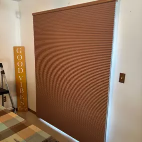 Large patio doors can become a source of cold in winter and heat in summer.  These double cell room-darkening cellular shades provide great insulation.