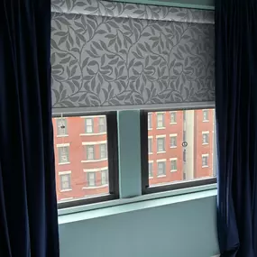 Room darkening roller shades are a great match for downtown condos where street lights and neighboring buildings can be a problem..  Elegant, and convenience.
