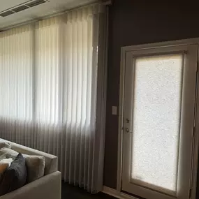 Floor-to-ceiling SmartDrape looks very elegant in large living room windows for condos in Indianapolis Downtown