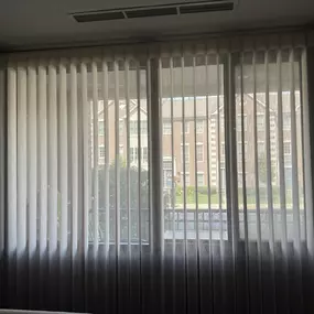 Floor-to-ceiling SmartDrape looks very elegant in large living room windows for condos in Indianapolis Downtown