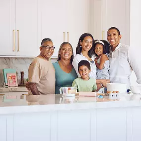 Family in kitchen after expert cabinet painitng in Birmingham AL