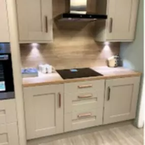 Cream cabinets and wooden worktops supplied and fitted by the Gallery