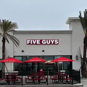 Exterior photograph of the Five Guys restaurant at 3048 US Highway 181 in Portland, Texas.