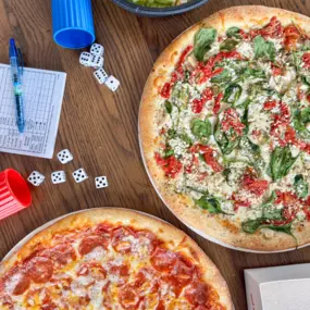 Two fresh pizzas, perfect for game night.