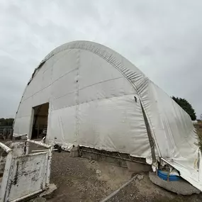 Even after 27 years, this fabric arena stands testament to structural longevity. Pilot Buildings revitalizes older structures like this with new, warrantied HDPE fabric covers, enhancing both appearance and function. Contact us for re-covering services.