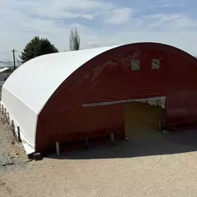Pilot Buildings presents the finished re-covered fabric arena. The new, durable HDPE fabric cover ensures this structure is ready for years of use. Trust Pilot Buildings for expert fabric structure re-covering and renovation.
