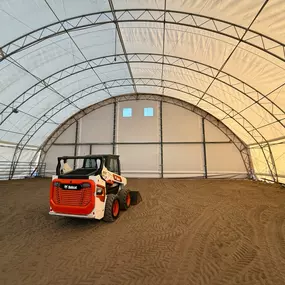 Nearing completion: Pilot Buildings transforms this 27-year-old arena with a new HDPE fabric cover. The bright interior showcases the quality installation.