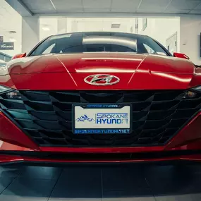 Front view of a red Hyundai model in Spokane, WA