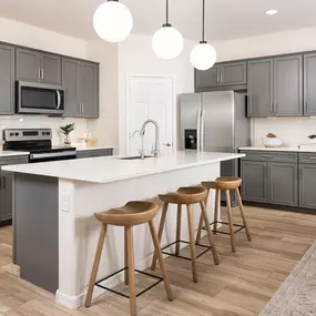 Modern bright kitchen at El Rancho Santa Rosa new construction in Maricopa, AZ, by Pulte Homes.