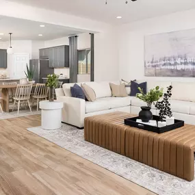 Spacious living room with hard wood floors in El Rancho Santa Rosa new construction in Maricopa, AZ.