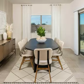 Dining area with outside access in El Rancho Santa Rosa new construction home in Maricopa, AZ.