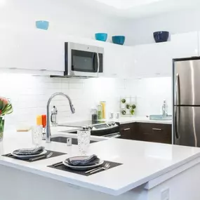 Kitchen with white countertops and stainless steel appliances