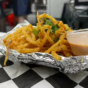 Haystack Onion Straws fried to perfection in our special seasoned batter