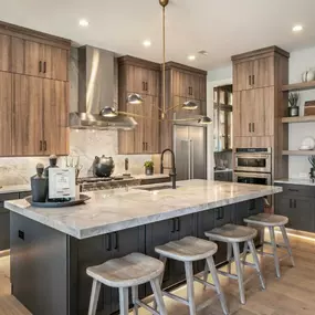 Well-appointed kitchens feature name-brand appliances and center islands