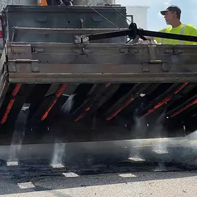 PLM Paving employees performing an infrared asphalt repair