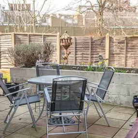 A garden and patio area, perfect for relaxing in the sun