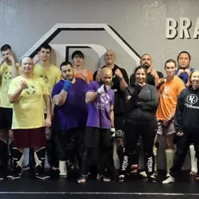 Community group photo with the owners and students of ProFound Fitness, representing a welcoming and supportive atmosphere where personal growth, connection, and transformation thrive.