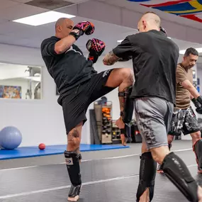 Kickboxing class focused on Muay Thai and Dutch-style striking, where students practice footwork, combos, and controlled sparring in a safe and structured environment for all levels.
