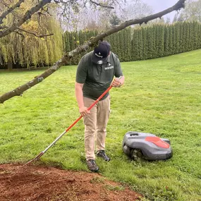 A person next to a red and robotic mower showcases the effortless lawn care.
#roboticlawnmower #lawnmaintenance