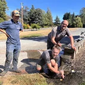 Three men are working together on a garden project as part of a lawn mowing team, focused on maintaining the landscape.
#landscapingservices #lawnmowingteam
