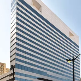 A tall building with a blue and white windows