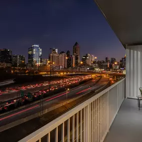 Private balcony with breathtaking city skyline views.