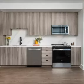 Sleek kitchen with full-height cabinetry and premium appliances.