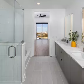 Elegant bathroom with a spa-like shower and double vanity.