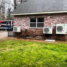 Expert Air A/C and Heating truck outside of a house