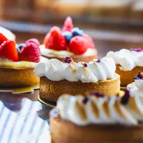 Fruit Tarts
Our fruit tarts are 100% handmade from scratch, using only the freshest ingredients. Topped with seasonal fruits, they are a perfect blend of sweet and tangy, showcasing true craftsmanship.