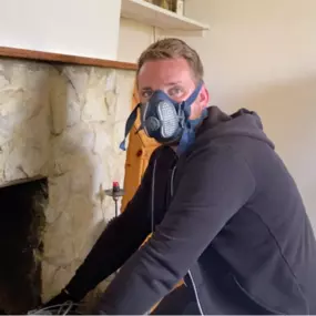 Our team using advanced tools to ensure thorough chimney cleaning.