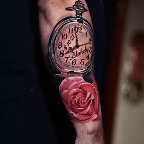 Custom tattoo design of a clock and rose by Brandon Sontag at RedTree Tattoo Gallery in Columbus, Ohio