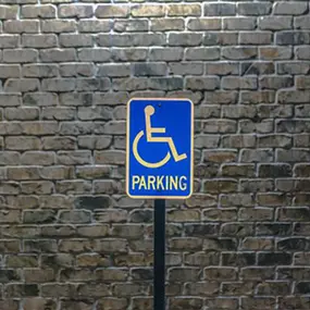 Professional parking lot sign installation in Dallas-Fort Worth, TX, featuring clear ADA-compliant signage, directional signs, and reserved parking indicators.