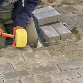 Expert paver installation and repair services in Dallas-Fort Worth, TX, ensuring durability, proper drainage, and aesthetic appeal for commercial properties.