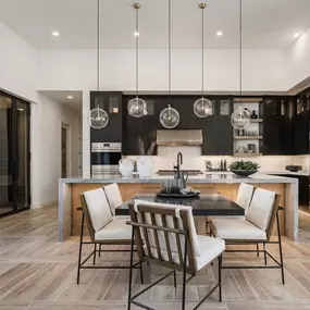 Stunning kitchens with ample cabinet space, large center islands, and high-end stainless steel appliances